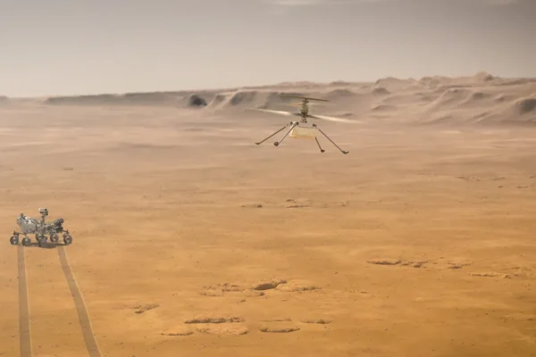 Una simulazione artistica del primo volo di test di Ingenuity Mars Helicopter su Marte, breve e vicino al rover Perseverance  I immagine: NASA/JPL-Caltech